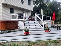 <b>TimberTech Terrain Stone Ash deck boards with Rustic Elm feature boards with White Lincoln Vinyl Railing with aluminum balusters-drink rail</b>